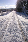 E & N Rail line as it passes through Nanaimo on a sunny, snowy winter day